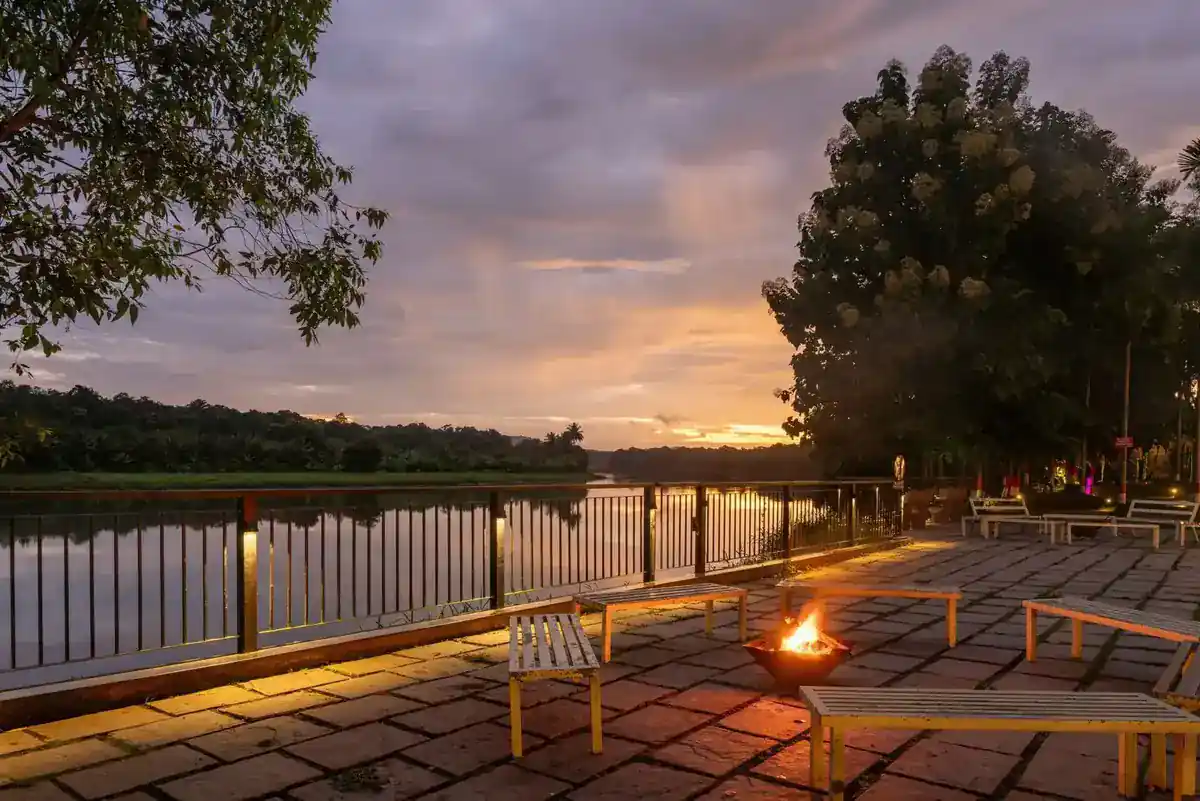 Riverside deck and sit-out area at River Edge Retreat Dandeli