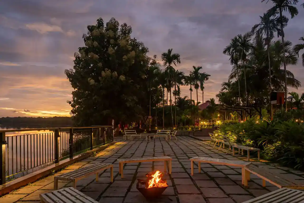 Garden walkway and cottage exteriors at River Edge Retreat Dandeli