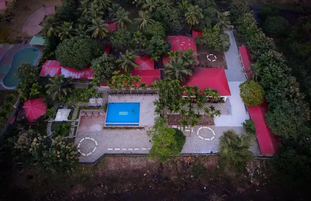 Poolside view with seating area at Dandeli Safar resort
