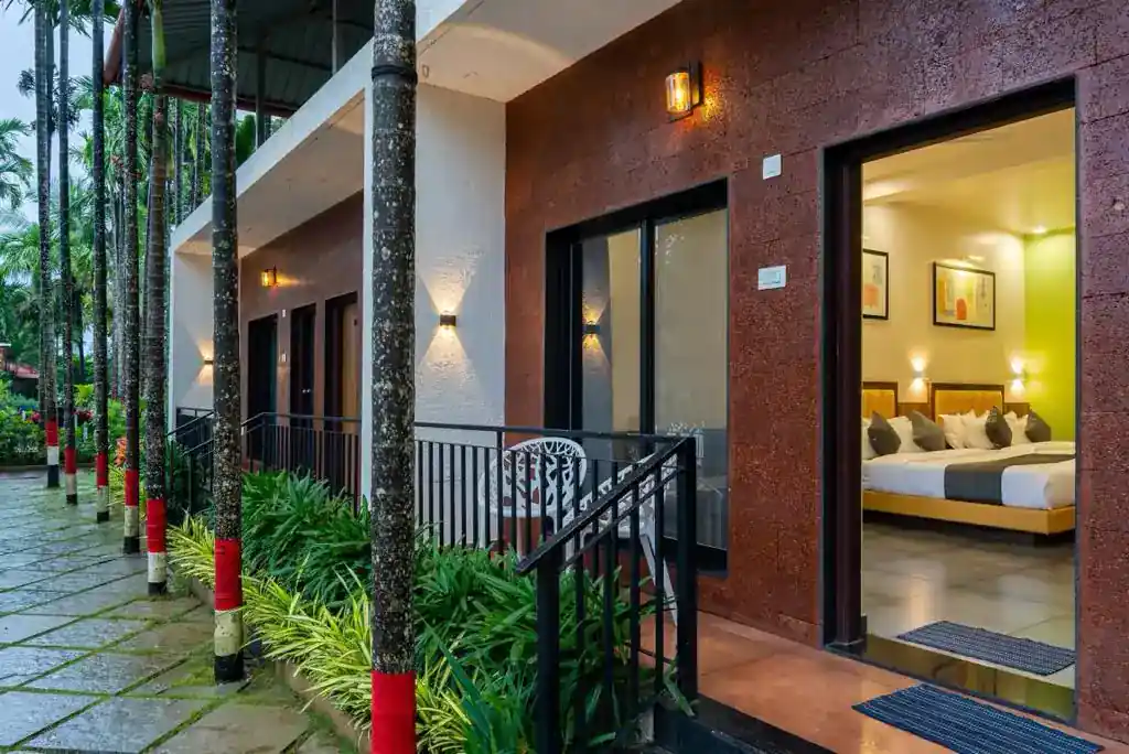 Pathway leading to riverside area at River Edge Retreat Dandeli